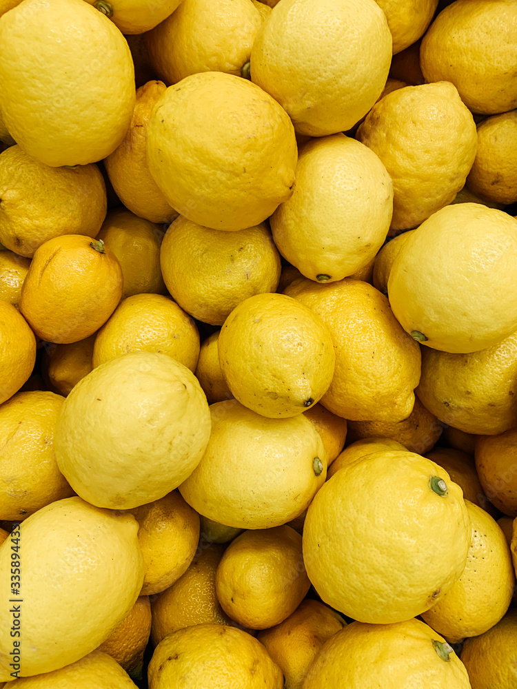 lots of ripe yellow lemons to eat like a background