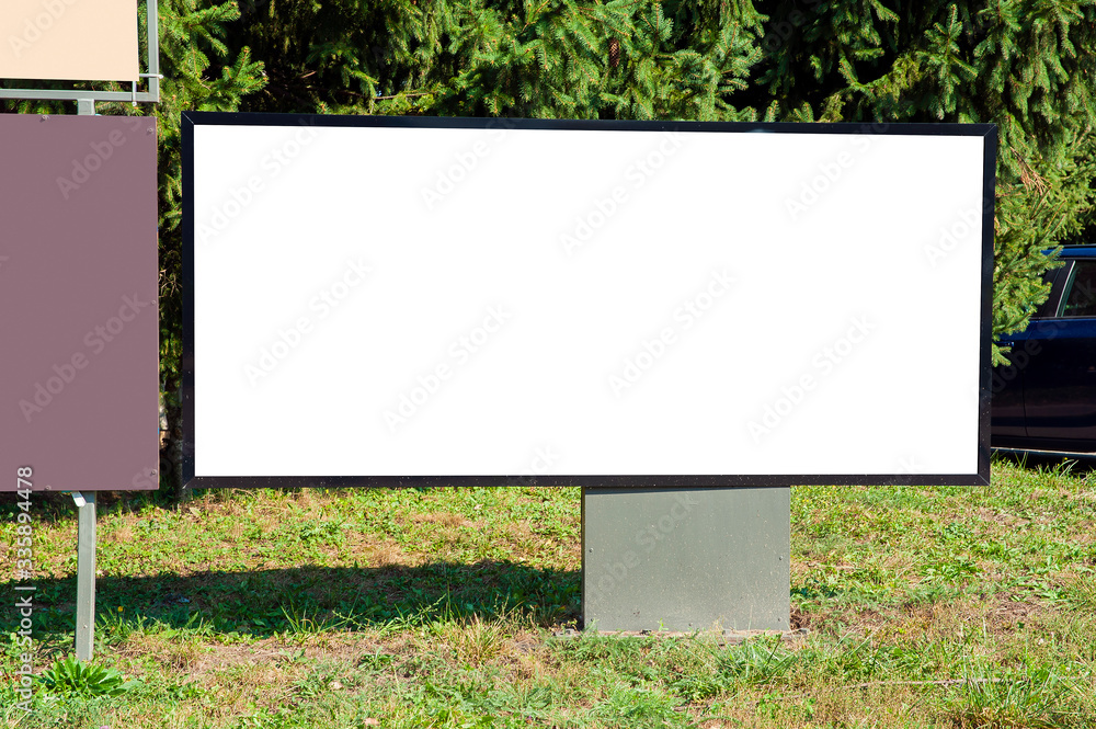 Blank white signboard on the lawn Blank white signboard on the lawn