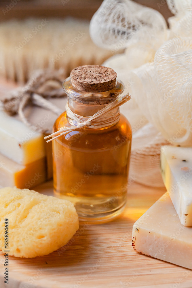 Concept of natural organic oil in cosmetology and home care. Moisturizing skin care and aromatherapy. Gentle body treatment. Atmosphere of harmony. Wooden background, brush, soap, sponge, washcloth
Concept of natural organic oil in cosmetology and home care. Moisturizing skin care and aromatherapy. Gentle body treatment. Atmosphere of harmony. Wooden background, brush, soap, sponge, washcloth