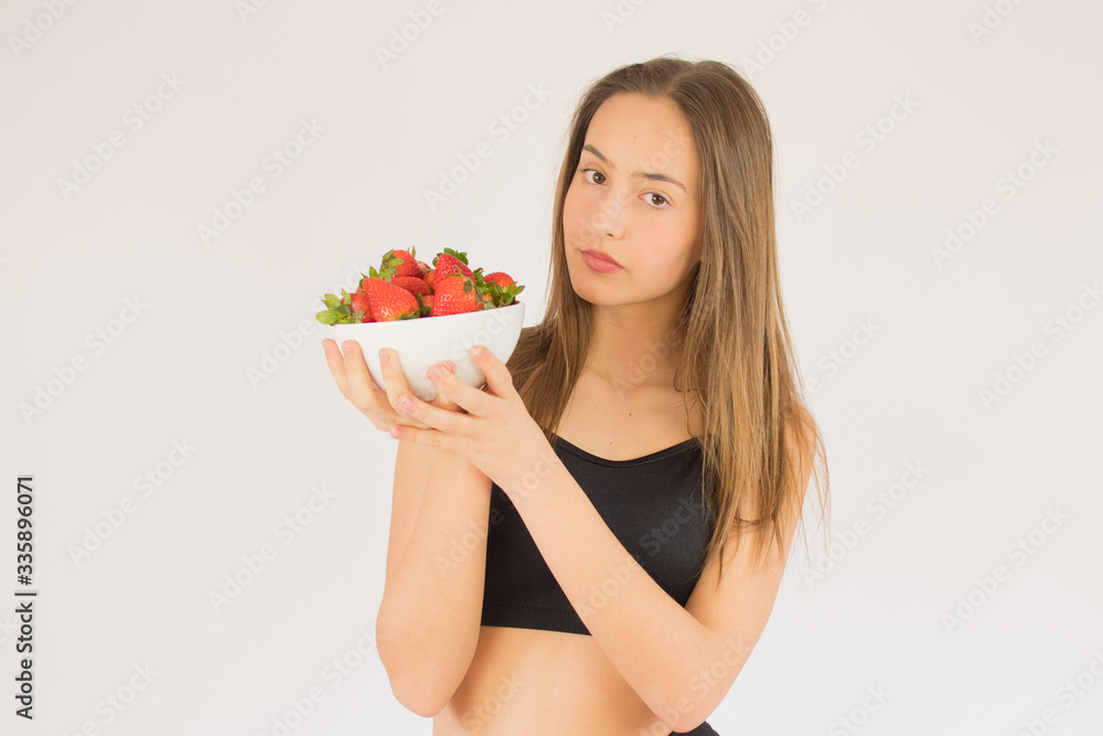 beautiful fitness girl with strawberries beautiful fitness girl with strawberries