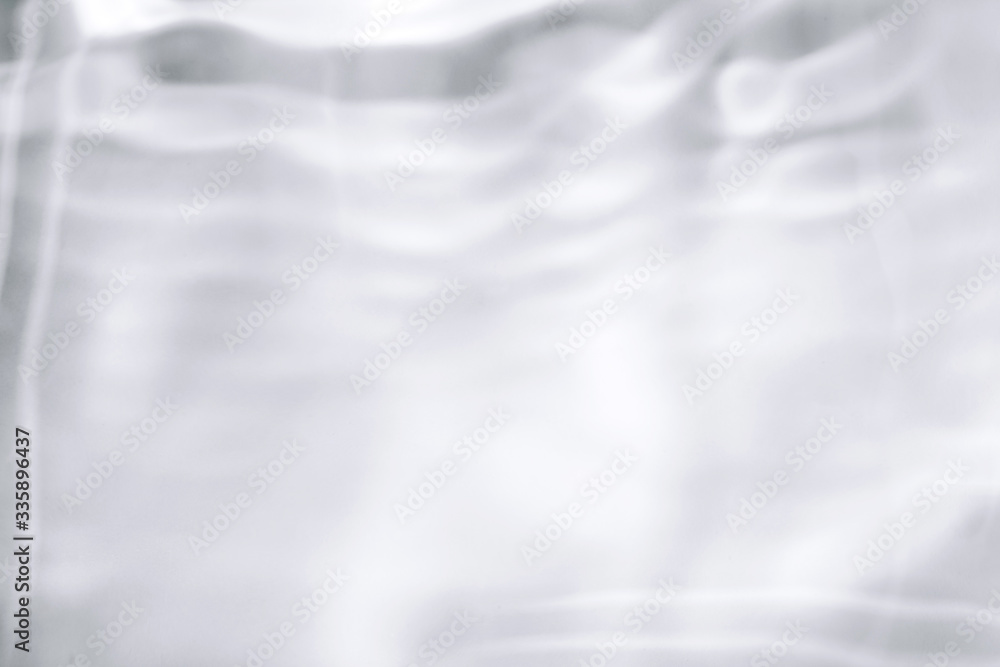 Obraz premium Shadows made with water. Blurred background made with water and light in monochrome. Pureness concept.