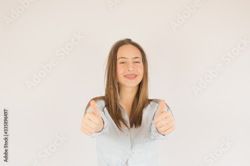 Wallpaper Mural Beautiful young girl with brackets smiling Torontodigital.ca