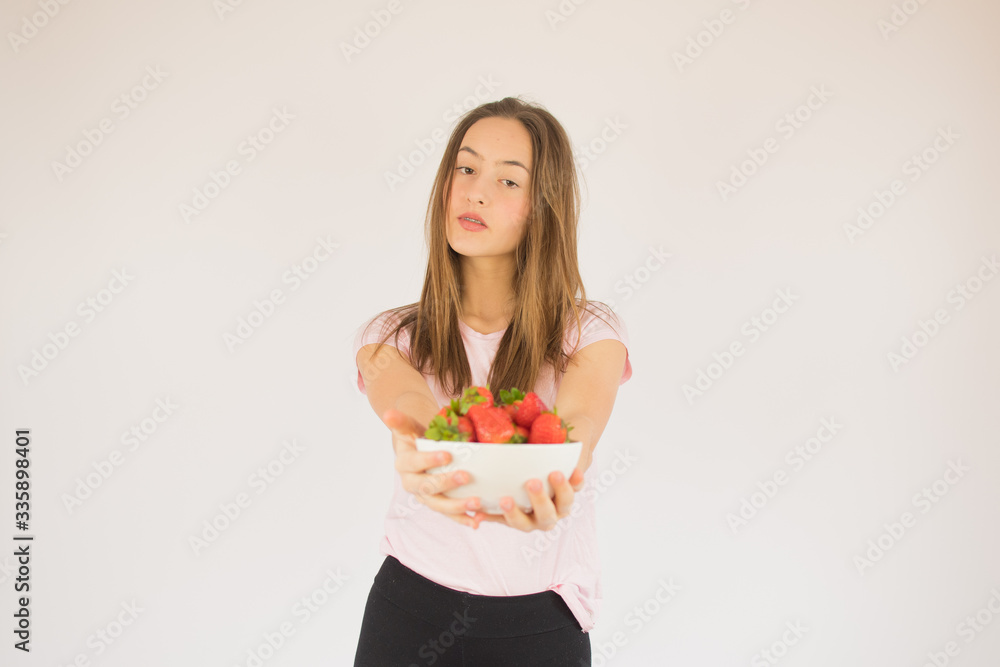 beautiful fitness girl with strawberries beautiful fitness girl with strawberries
