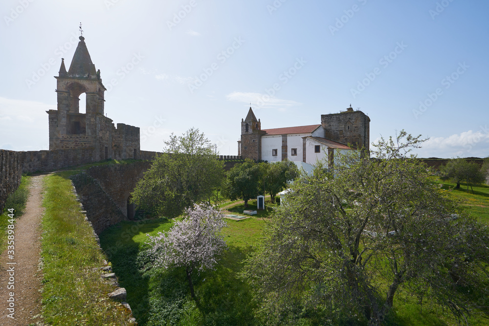 Mourao castle towers and wall historic building with interior garden in Alentejo, Portugal