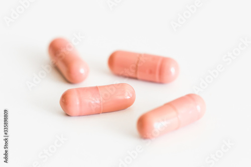 Pills on a light background with place for text. Biological supplements  vitamins  medicines for health.