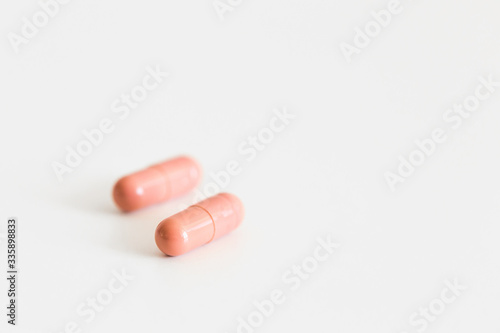 Pills on a light background with place for text. Biological supplements, vitamins, medicines for health.