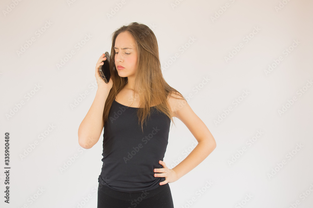 Young beautiful girl with mobile phone surprised Young beautiful girl with mobile phone surprised