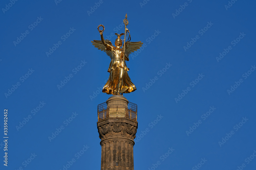 close-up of the Goldelse, the Statue of St. Victoria on the Victory Column, Tiergarten, Berlin city, Germany on a sunny day with a beautiful blue sky