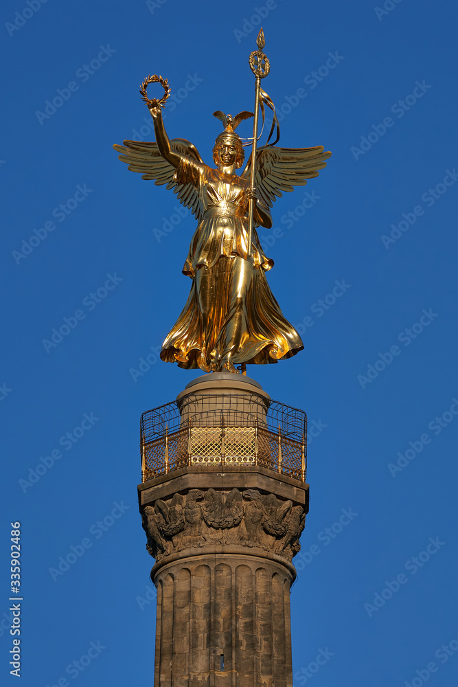 close-up of the Goldelse, the Statue of St. Victoria on the Victory Column, Tiergarten, Berlin city, Germany on a sunny day with a beautiful blue sky