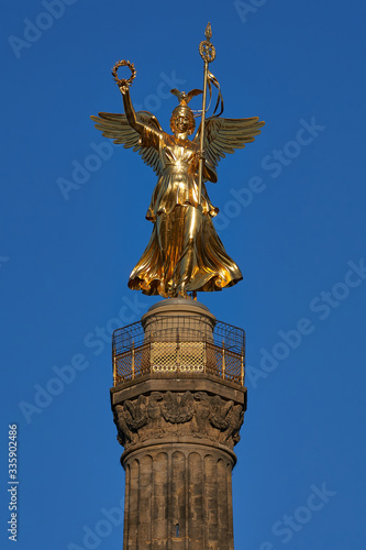 close-up of the Goldelse, the Statue of St. Victoria on the Victory Column, Tiergarten, Berlin city, Germany on a sunny day with a beautiful blue sky