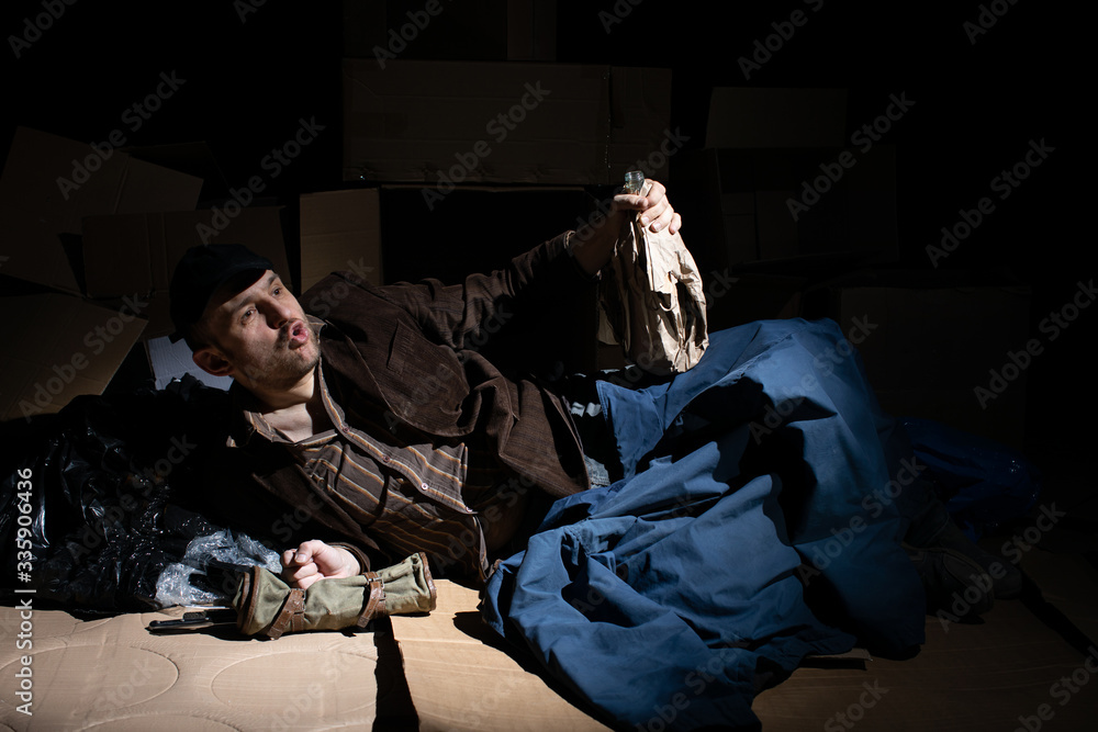 A middle-aged homeless man became alcoholic because of his situation. A middle-aged homeless man became alcoholic because of his situation.