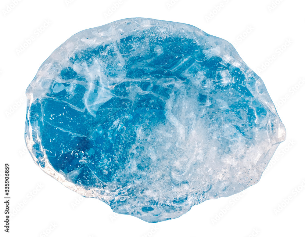 A piece of neon blue ice on a white background A piece of neon blue ice on a white background