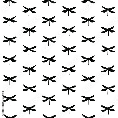 Vector seamless pattern of black sketch dragonfly silhouette isolated on white background © Sweta