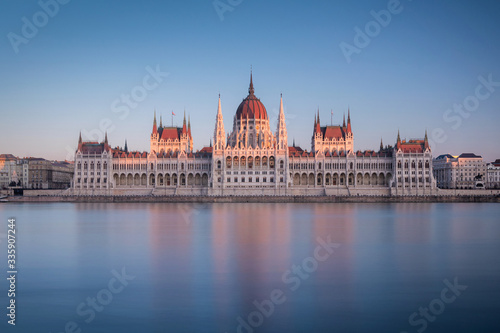 The Hungarian Parliament Building on the bank of the Danube at the sunset in Budapest