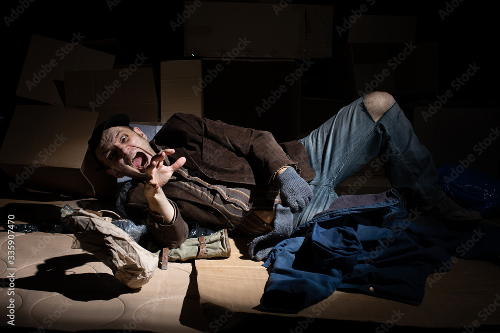 A middle-aged homeless man became alcoholic because of his situation. A middle-aged homeless man became alcoholic because of his situation.