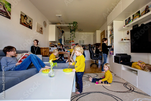 Fotografie Many kids, doing different activities at home, reading book, playing with toys,