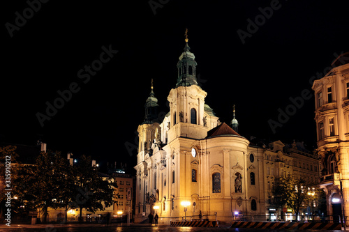 View of St Nicholas  Church in the Old Square of Prague  lit up at night