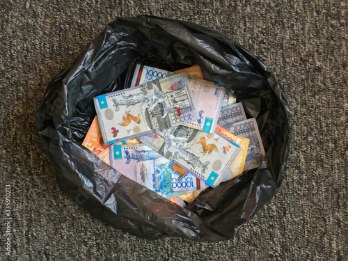Money of the country of Kazakhstan large bills in a dirty bag dirty background for design
