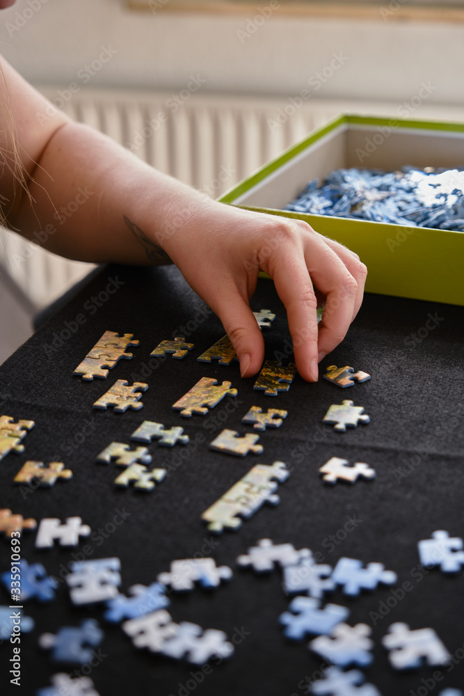 woman puzzles at home woman puzzles at home