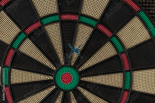 Red and blue dart arrrow hitting in the target.Darts sport concept