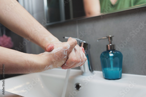 Man is washing hands with soap. Coronavirus Covid-19 prevention. Stop corona virus pandemic. Hygiene.