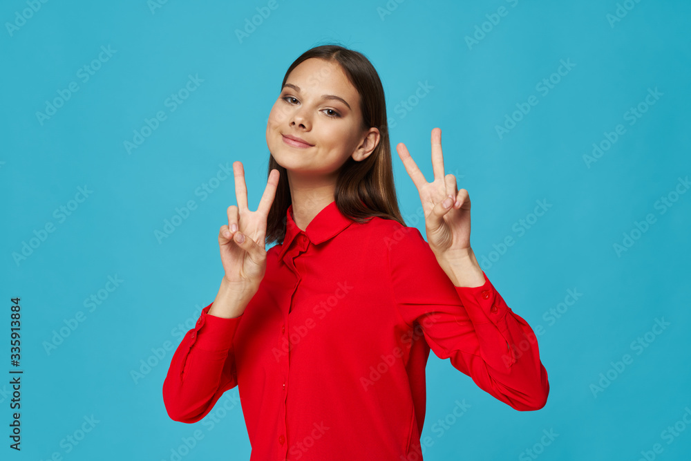 young woman showing thumbs up young woman showing thumbs up
