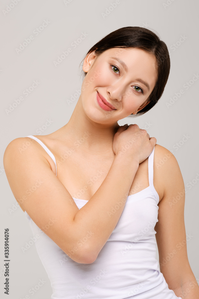 Portrait of beautiful happy asian girl in white t-shirt and natural makeup Portrait of beautiful happy asian girl in white t-shirt and natural makeup