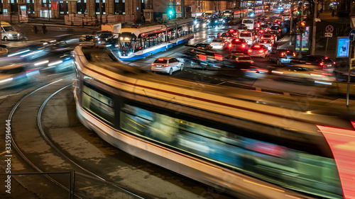 Extremely heavy traffic of trams and cars  on the crossroad