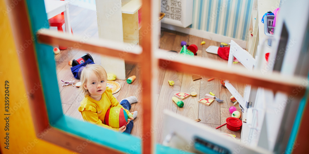 Adorable little girl in kindergarten, daycare or preschool Stock Photo