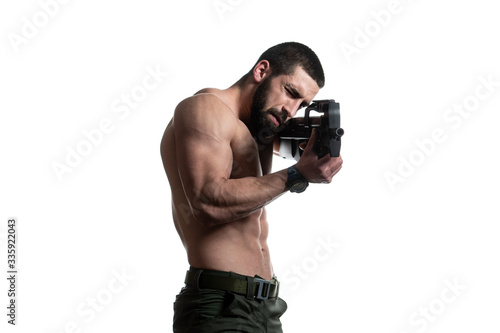 Bodybuilder Man Holding Gun Isolated on White Background