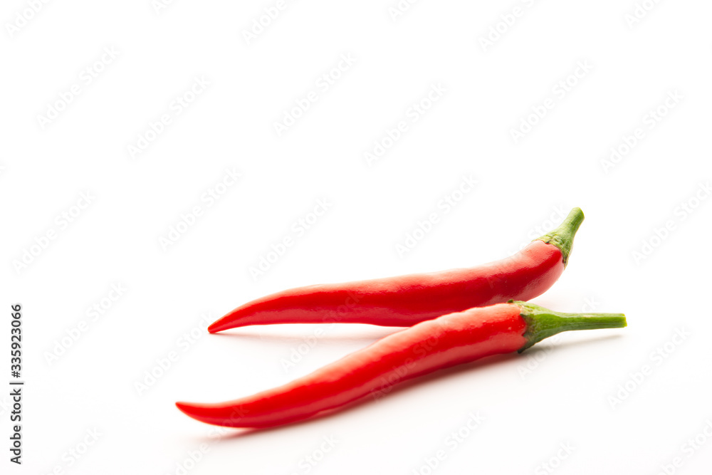 Red chili peppers on a white background. Isolate. Hot peppers. Fresh pod of red pepper. Red chili peppers on a white background. Isolate. Hot peppers. Fresh pod of red pepper.