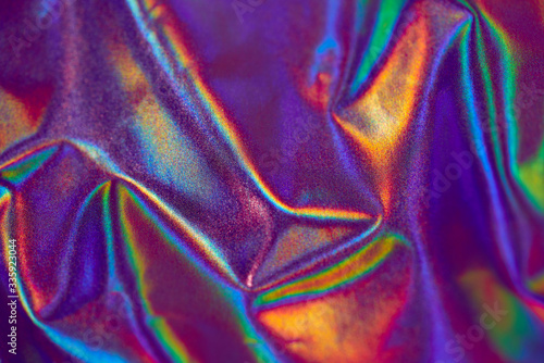 Holographic iridescent mermaid foil texture red-purple, Futuristic neon colors photo