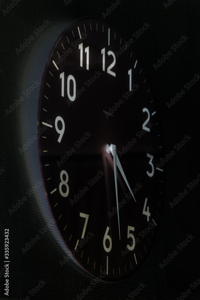 black wall clock with large dial