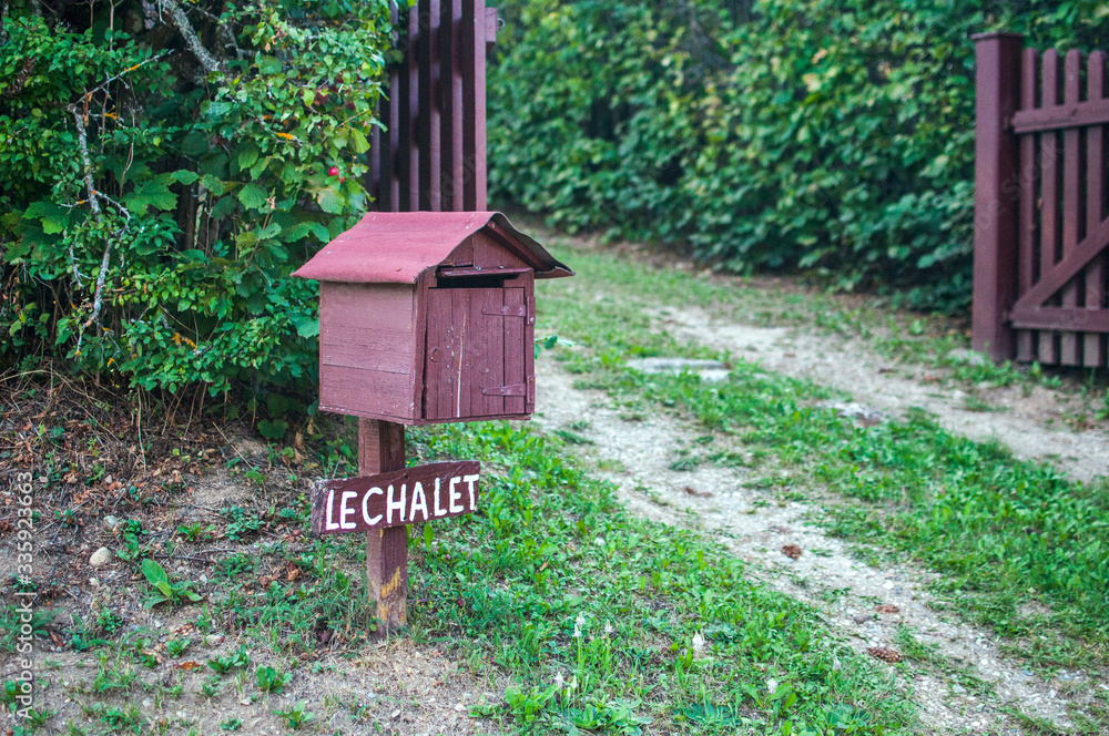 Wooden mailbox shaped like a house Wooden mailbox shaped like a house