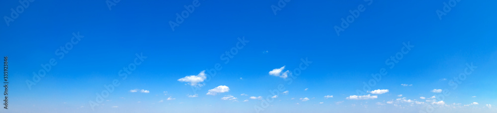 Blue Sky background with tiny Clouds. Panorama background