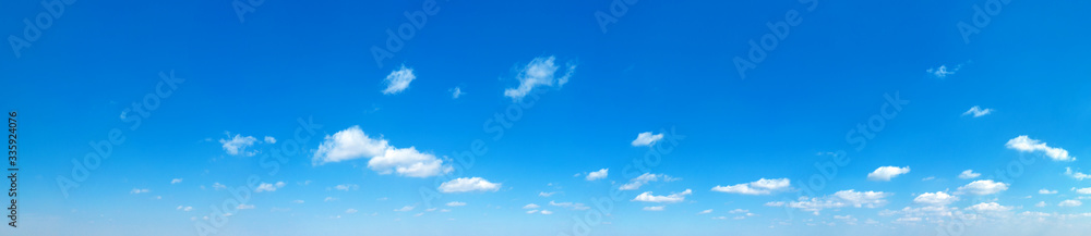 Fototapeta premium Blue Sky background with tiny Clouds. Panorama background