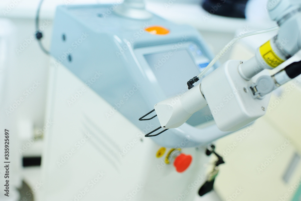 modern device for skin rejuvenation-fractional laser close-up on the background of a cosmetology clinic modern device for skin rejuvenation-fractional laser close-up on the background of a cosmetology clinic