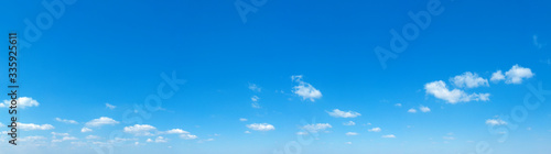 Blue sky background. Natural background. Panorama sky with tiny clouds photo