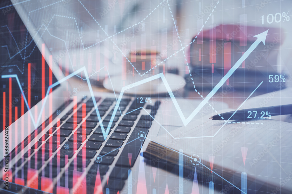 Double exposure of financial chart drawing and desktop with coffee and items on table background. Concept of forex market trading Double exposure of financial chart drawing and desktop with coffee and items on table background. Concept of forex market trading