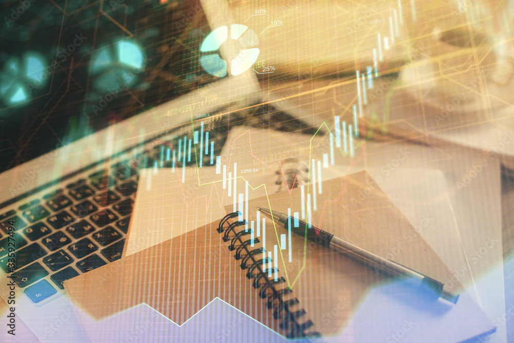 Double exposure of financial chart drawing and desktop with coffee and items on table background. Concept of forex market trading Double exposure of financial chart drawing and desktop with coffee and items on table background. Concept of forex market trading