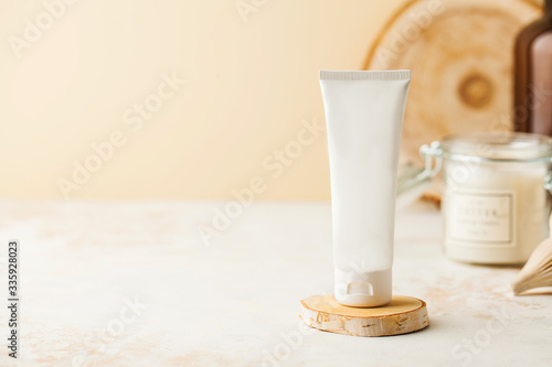 Spa concept, skin care. Mock up of a cosmetic tube of cream or gel with place for text. Ready for packaging design. 