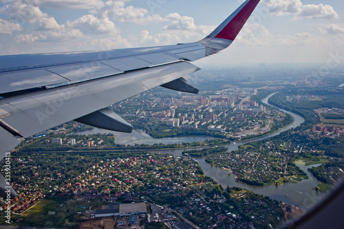 Aerial view of Moscow, Russia, from an airplane with wing traveling concept