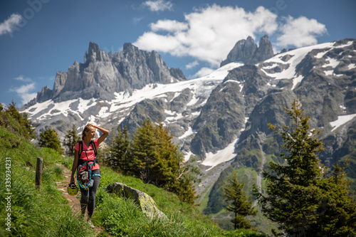 Pretty, female hiker/climber in a lovely alpine setting of Swiss Alps