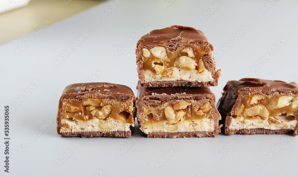 chocolate candy bar with peanuts and nougat chocolate candy bar with peanuts and nougat