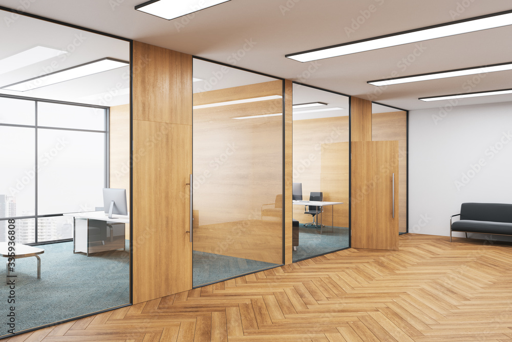 Obraz premium Wooden coworking office with equipment and city view.