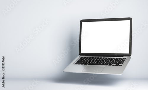 Blank white mock up screen of modern laptop
