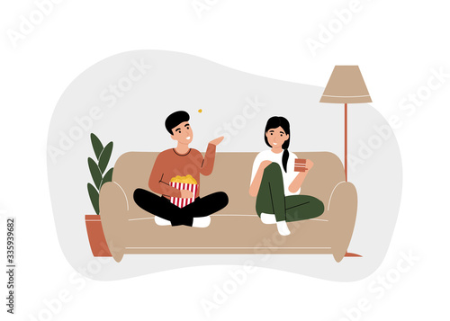 Couple man amd woman sit on the couch, watching movie TV and eating popcorn together. Stay home coronavirus quarantine. Flat vector modern cartoon illustration design concept.