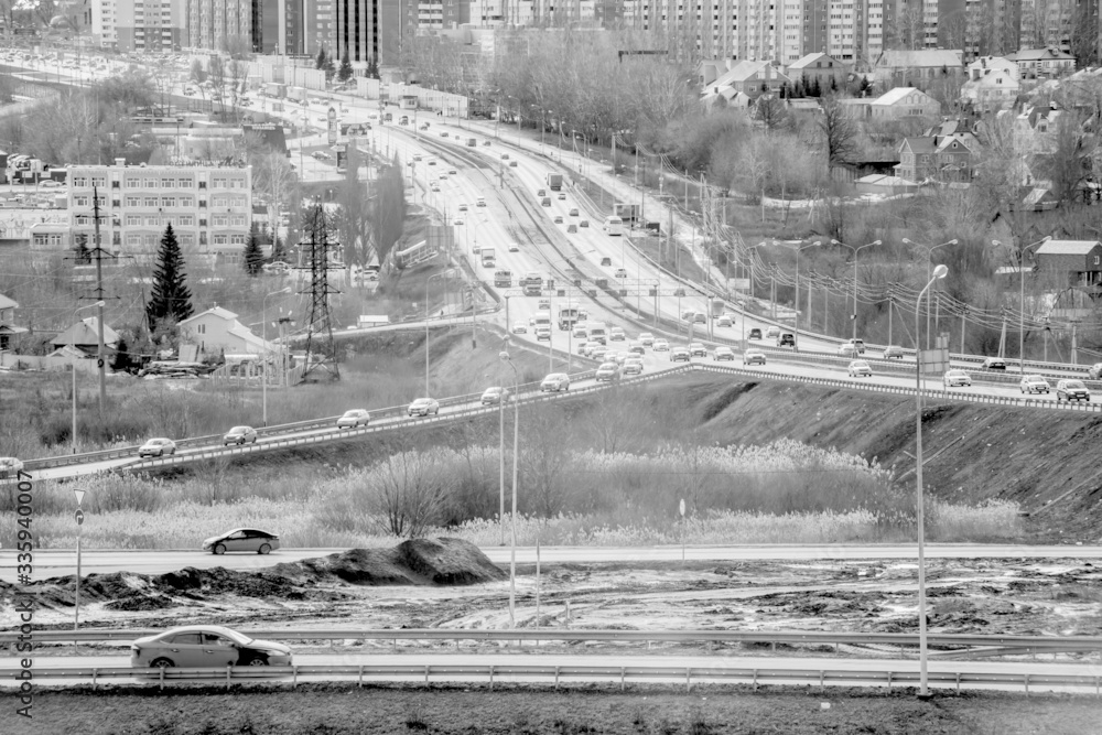 urban traffic intersection with many cars panoramic view, monochrome