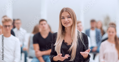 young woman on a blurred background of the auditorium