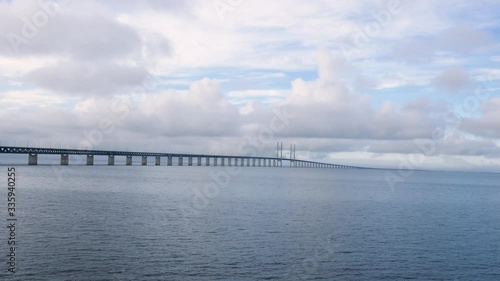 Wallpaper Mural Long shot of Oresund Bridge over the sea, the borden between Sweden and Denmark with a cloudy blue sky in background Torontodigital.ca